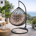 Sedia sospesa poltrona a uovo con cuscini e struttura in acciaio